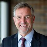 Professional headshot of John Doe, CEO